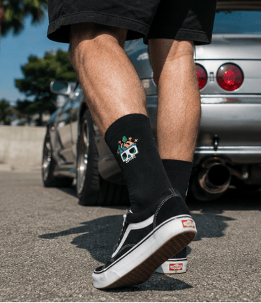 Black crew socks with embroidered skull